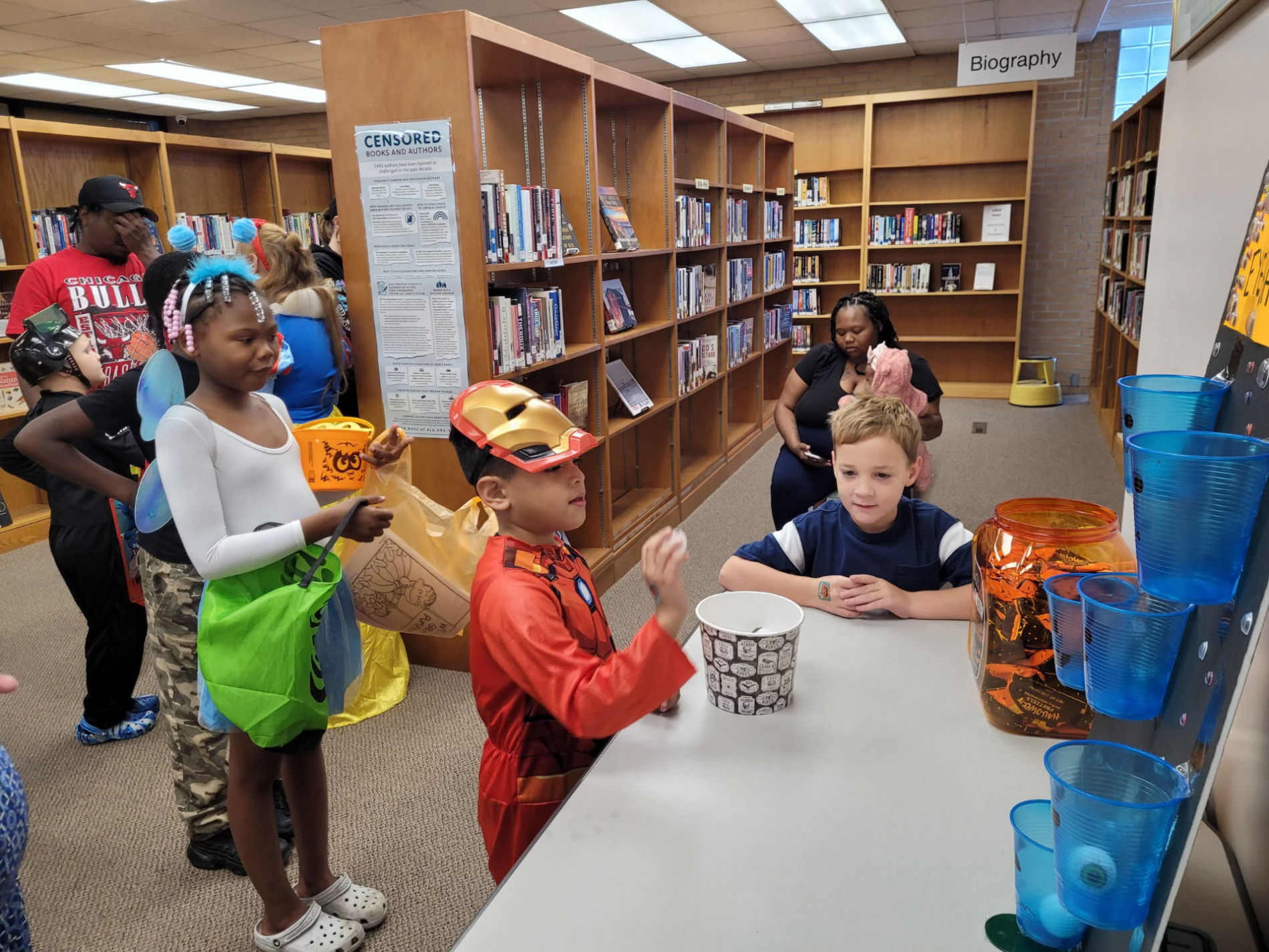Children and families enjoying Halloween party activities