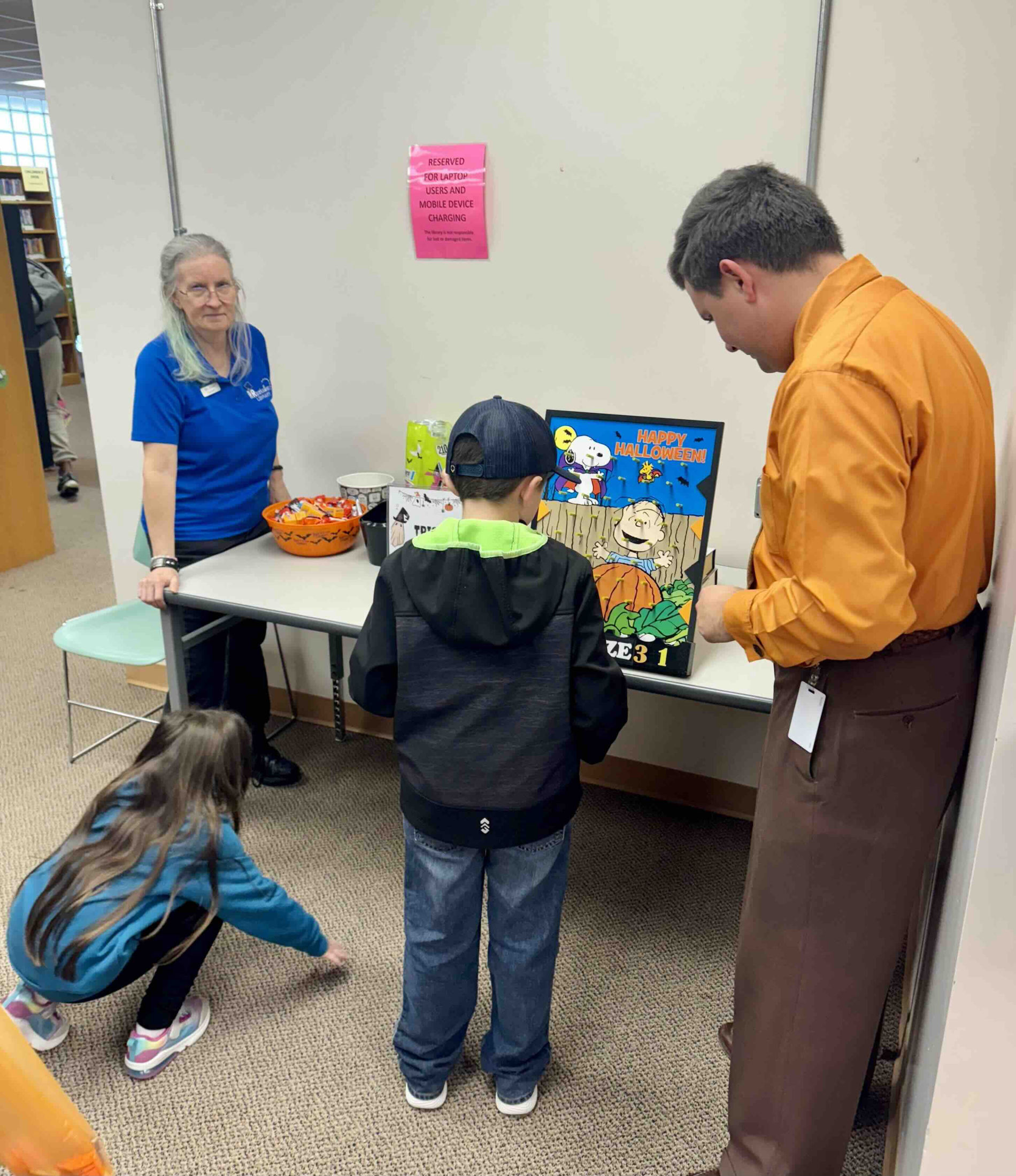 Children and families enjoying Halloween party activities