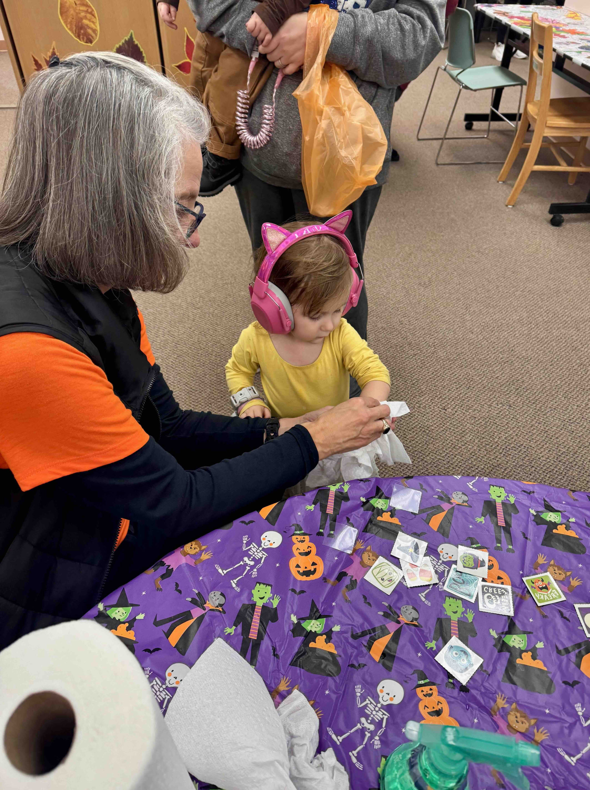 Children and families enjoying Halloween party activities