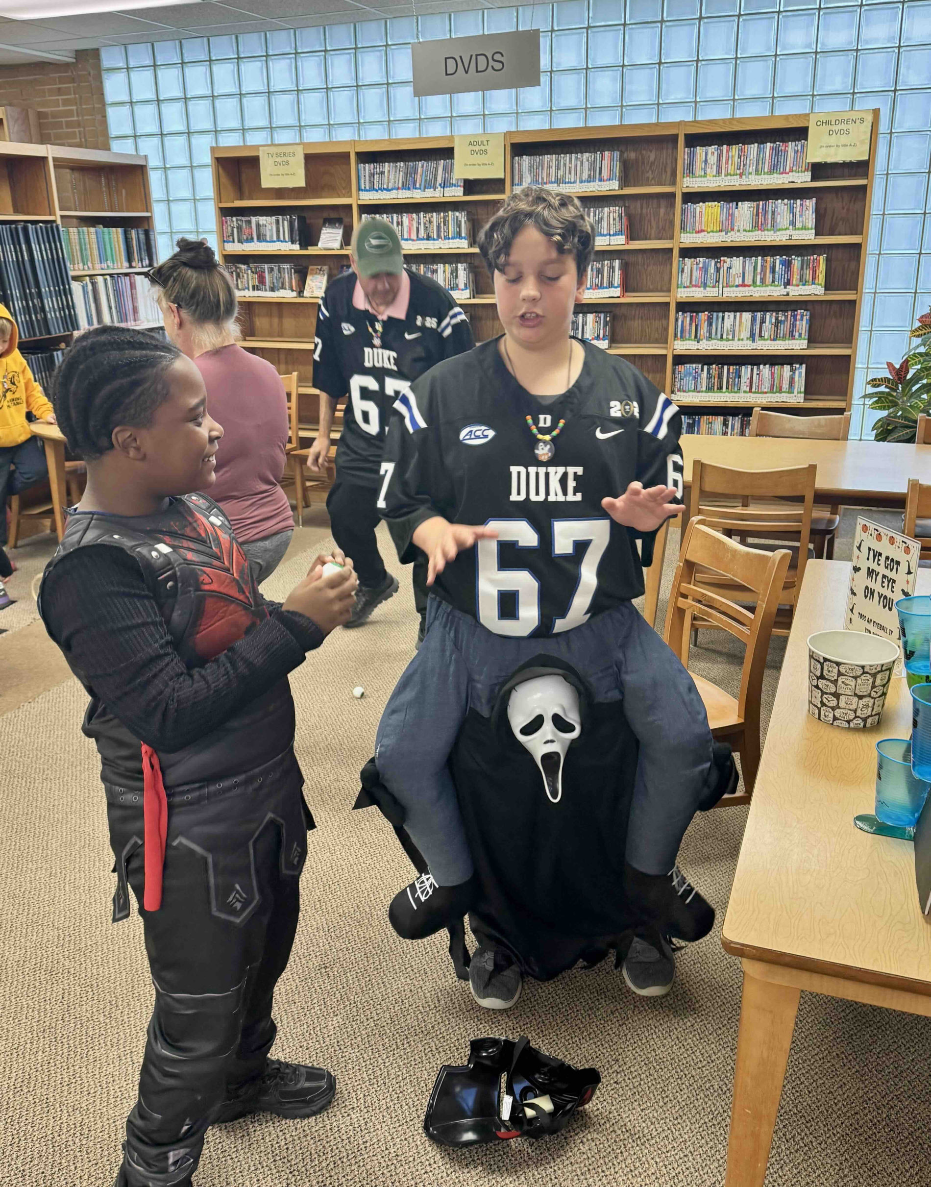 Children and families enjoying Halloween party activities
