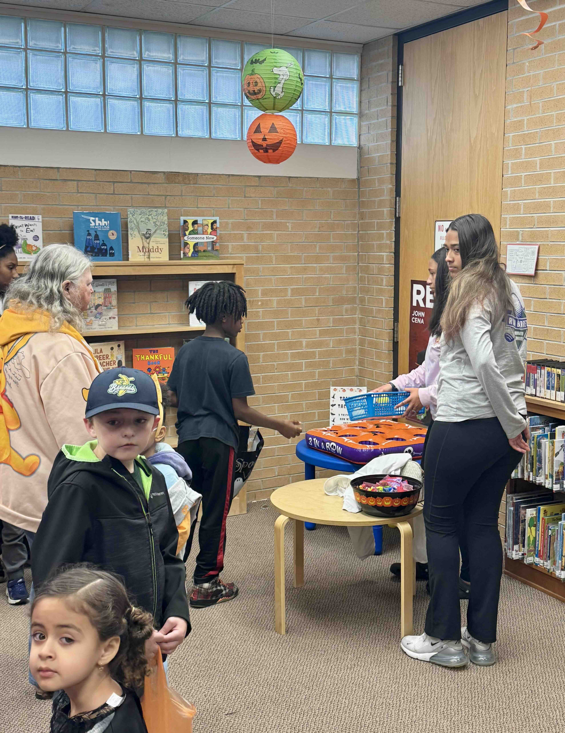 Children and families enjoying Halloween party activities
