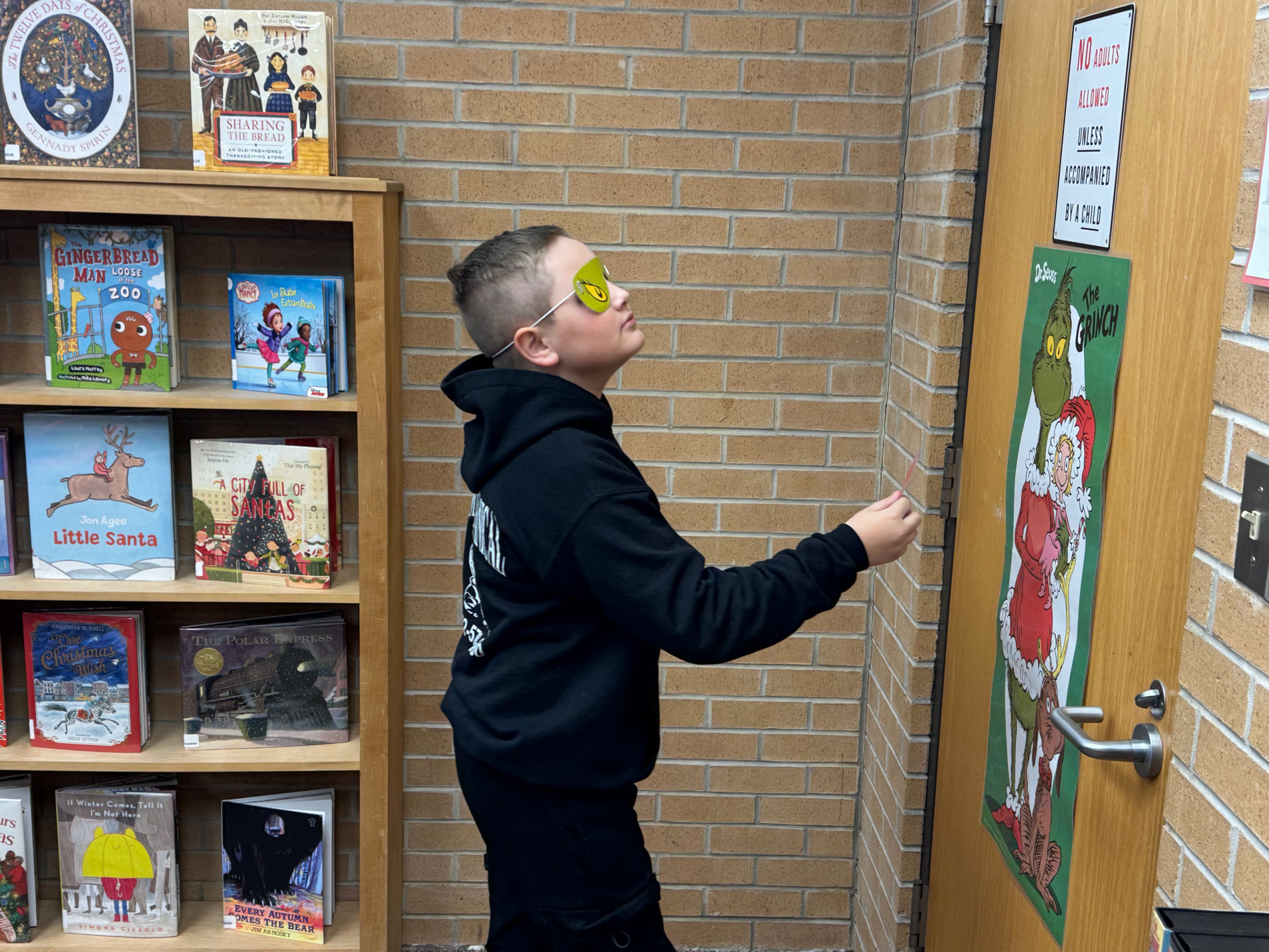 Kids enjoying a Grinchmas party at the library