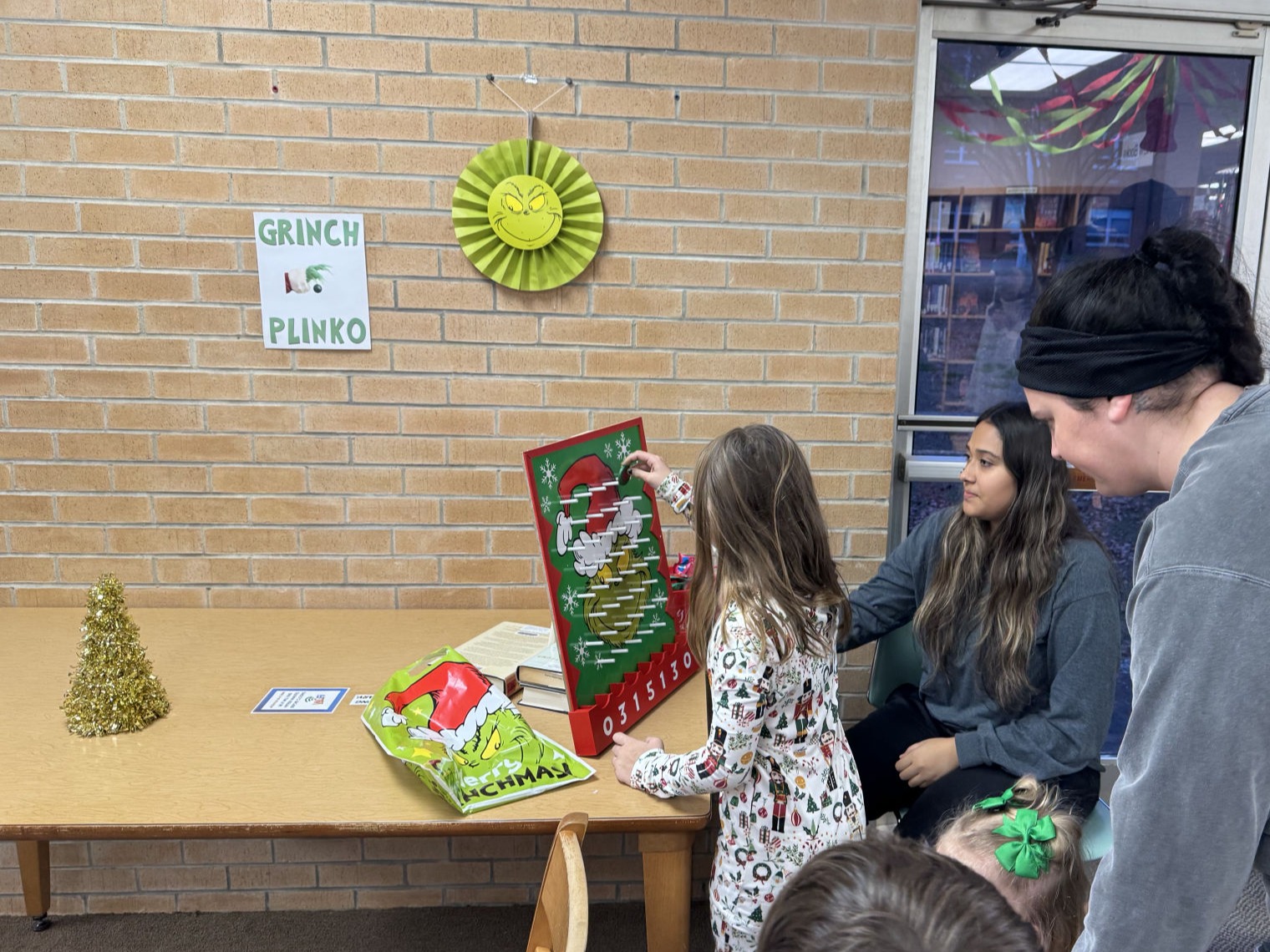 Kids enjoying a Grinchmas party at the library